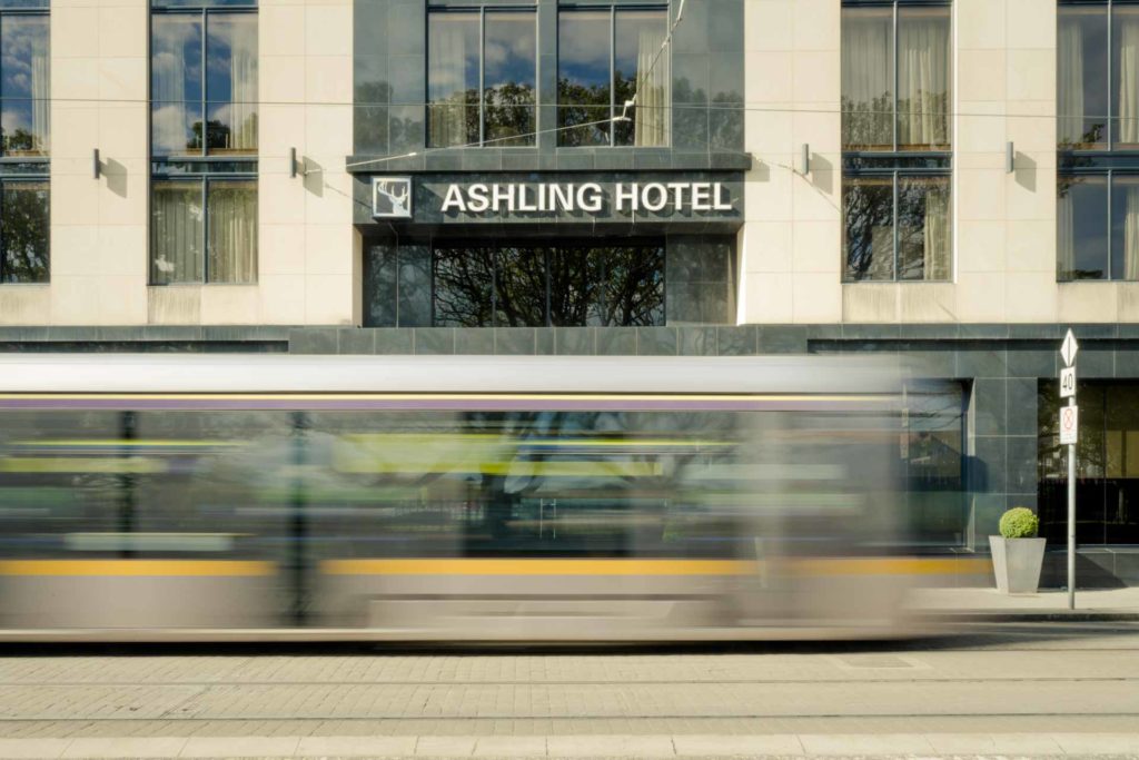 Luas Tram Line Swiftly passing by the main enterance at Ashling Hotel, Dublin.